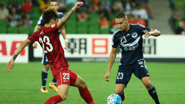 Shanghai SIPG's Huan Fu challenges Jai Ingham for the ball in the ACL at Melbourne Rectangular Stadium.